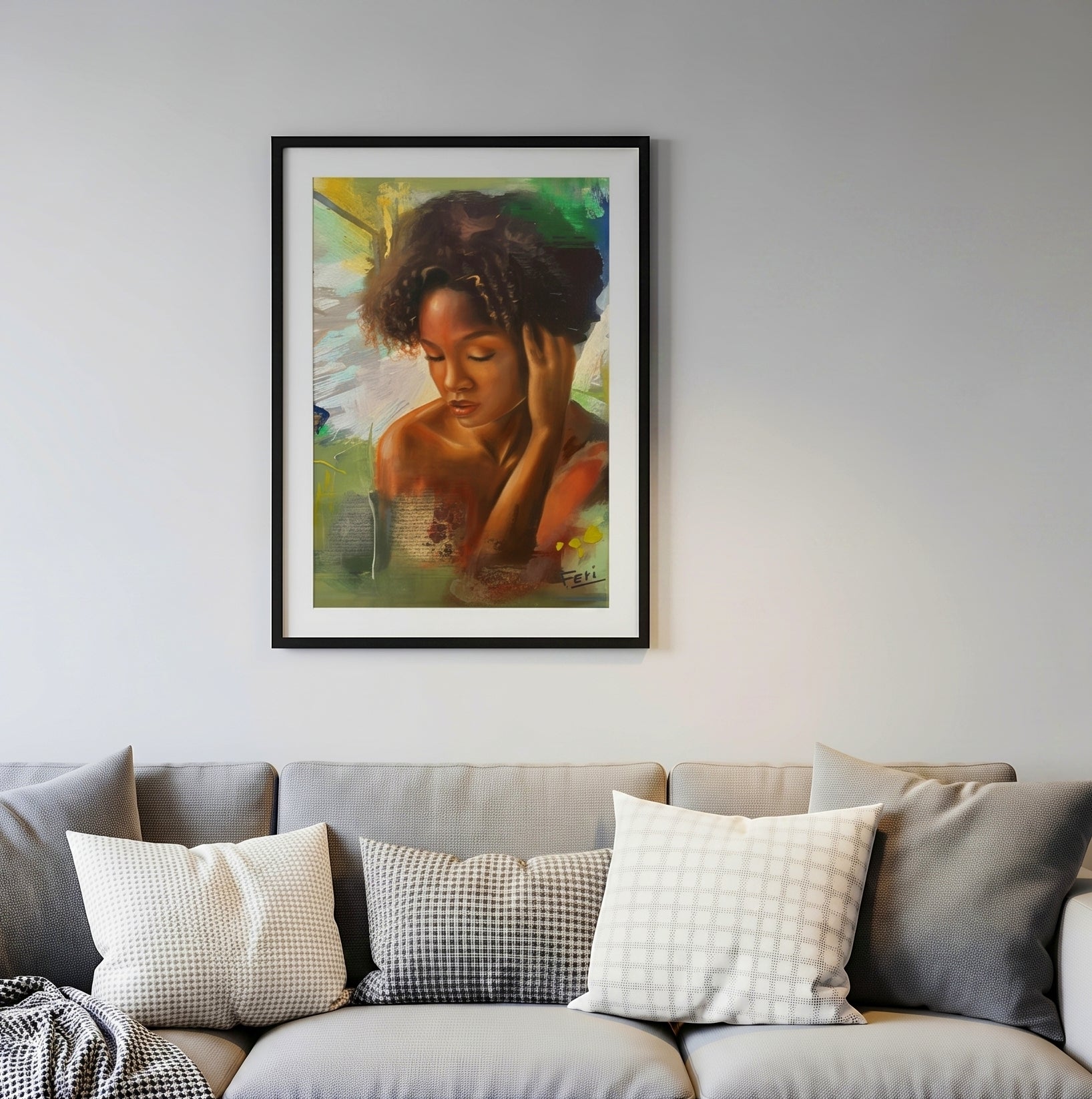 my peace is A framed art print displayed in a black wood frame depicting a black african mixed woman with dark curly hair, displayed on a light grey wall above a grey sofa.