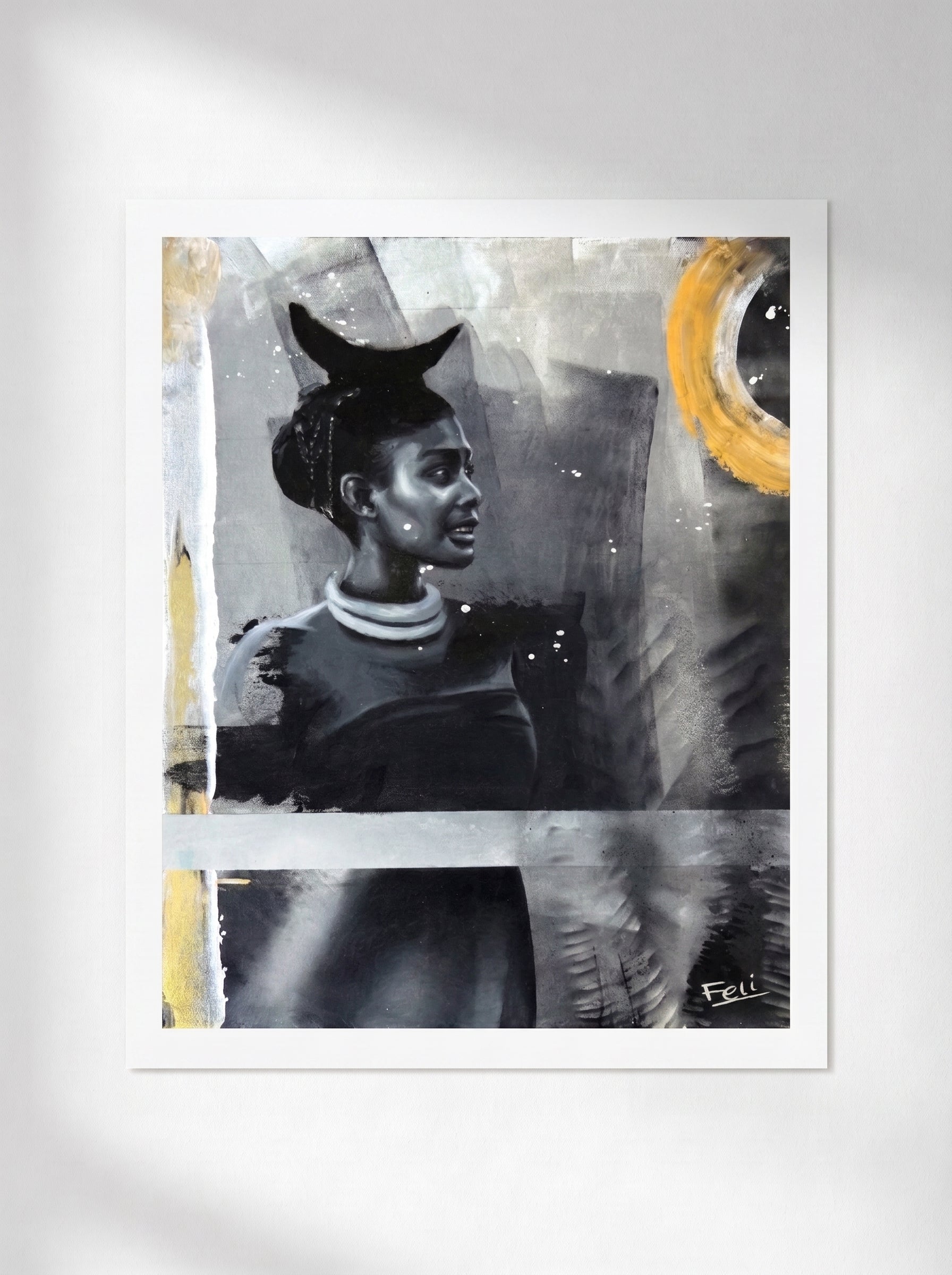 An unframed art print featuring an abstract portrait of a black african or indian woman in grayscale with yellow gold accents, displayed against a light gray wall by feli the artist titled my footprints.