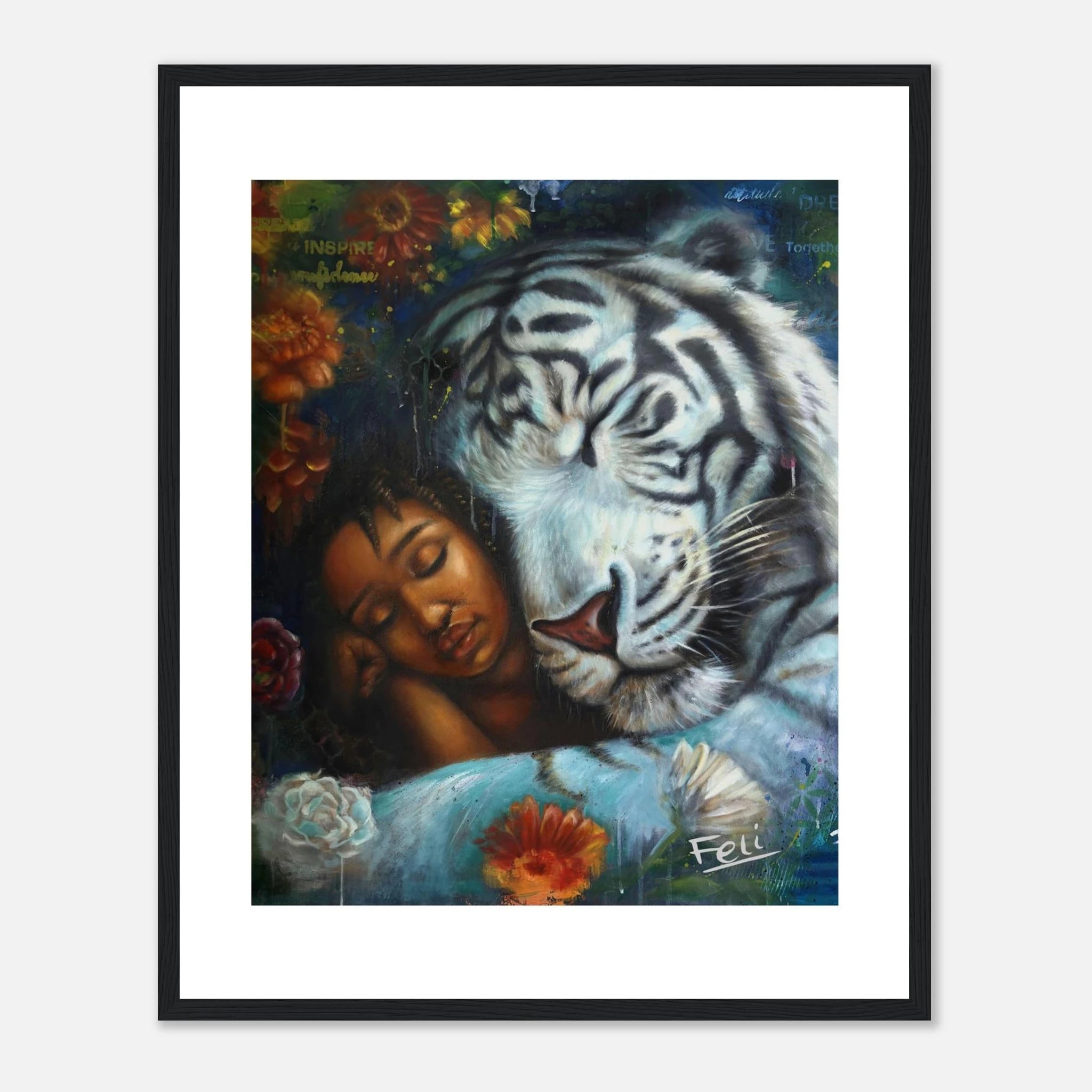 A framed art print entitled wild heart gentle soul by feli the artist featuring a painted scene of a sleeping woman resting against a large white tiger, with flowers and a dark blue background, shown hanging in a black picture frame on a light wall.