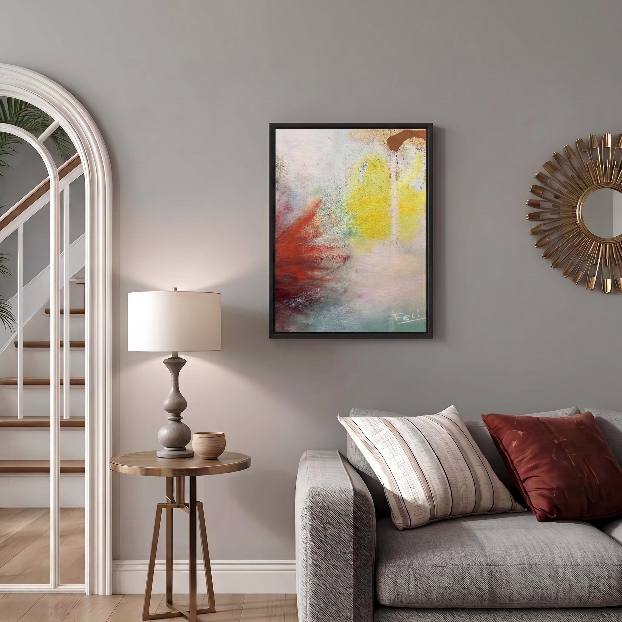 A touch of the sky by Feli the Artist Abstract framed art print on Hahnemühle German Etching paper with expressive brushstrokes in yellow, red-orange, teal, white, and brown framed and hang on livingroom wall.