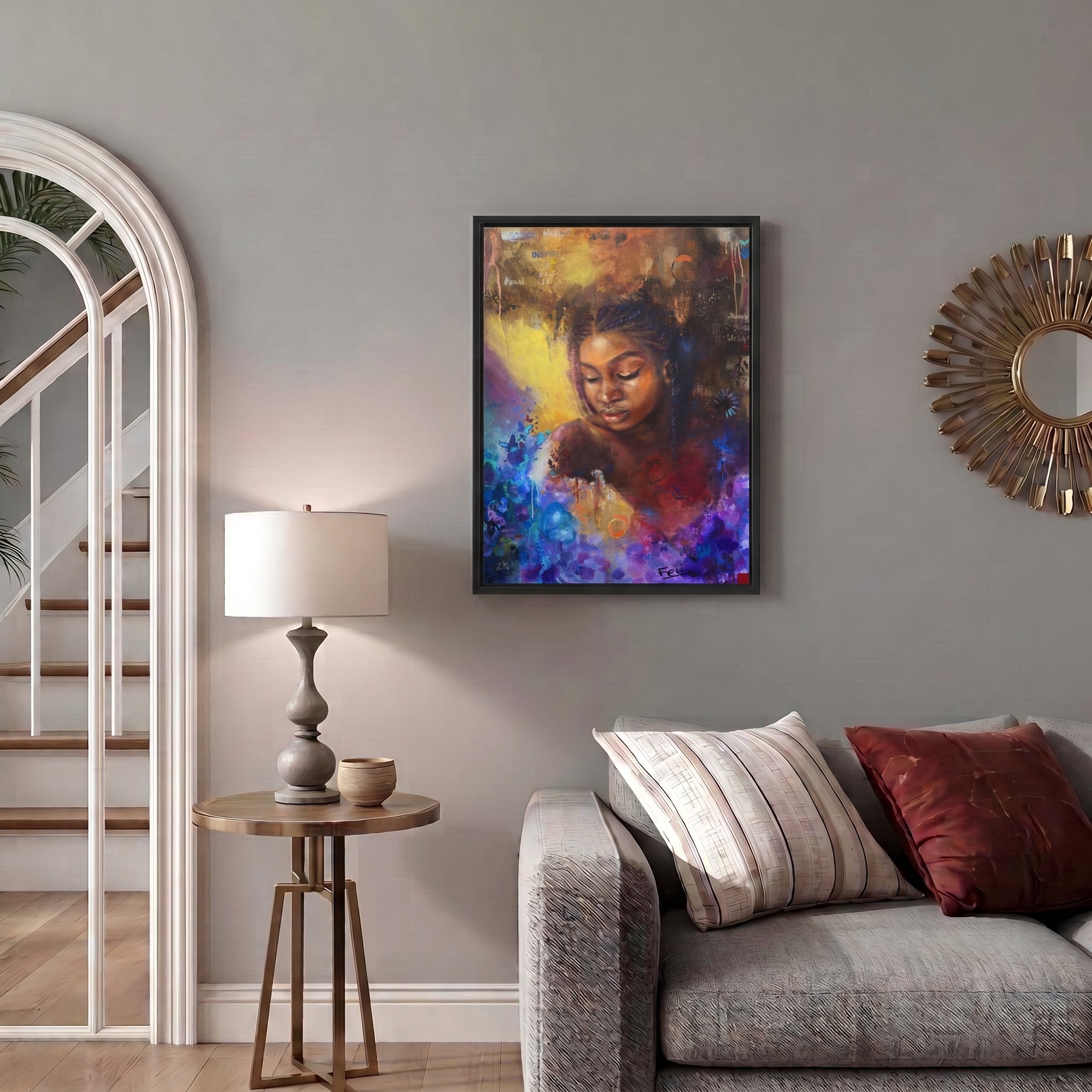As She Blooms by Feli the Artist, framed floral abstract realism art print of a young Black African woman with braided hair, featuring expressive brushstrokes, floral elements, and warm brown, gold, red, and blue tones displayed on a living room wall.